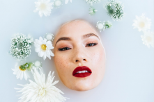 a white face and red lips