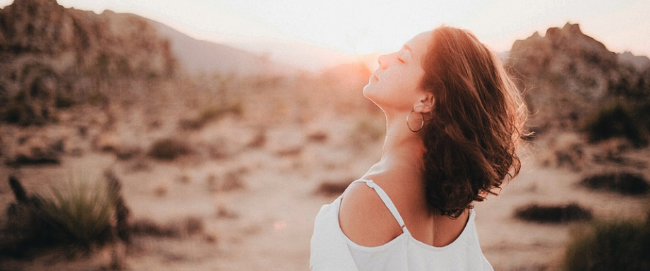 a woman feeling the summer breeze